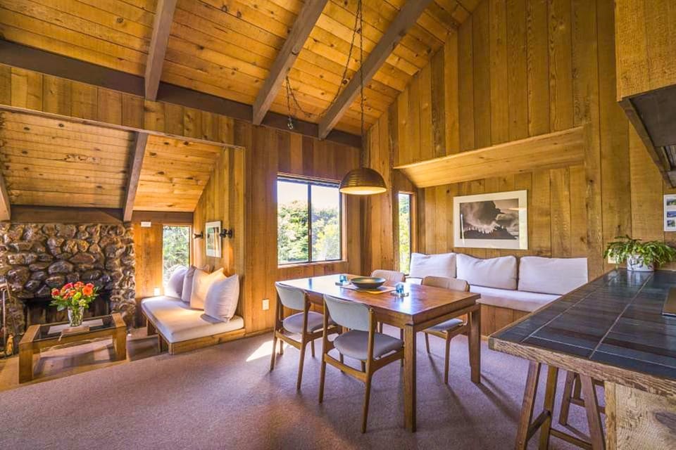 Gather around the dining table for memorable meals and lively conversations, all while soaking in the natural light and warm wood tones.