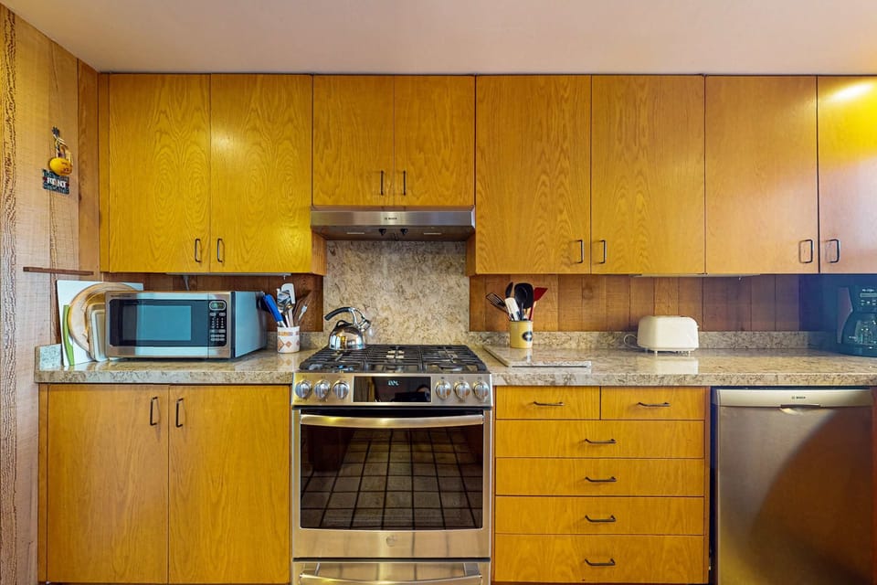 Unleash your inner chef in this well-equipped kitchen, where culinary dreams meet stunning ocean views to inspire your creations.