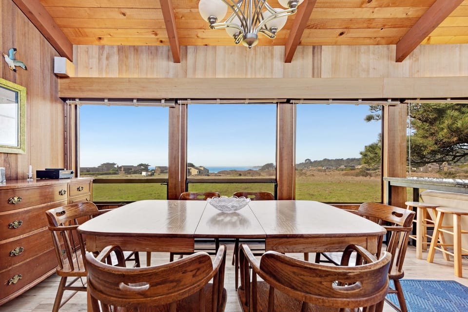 Imagine sharing stories and laughter over dinner, with panoramic windows that invite the outside in, creating a perfect backdrop for memorable gatherings.