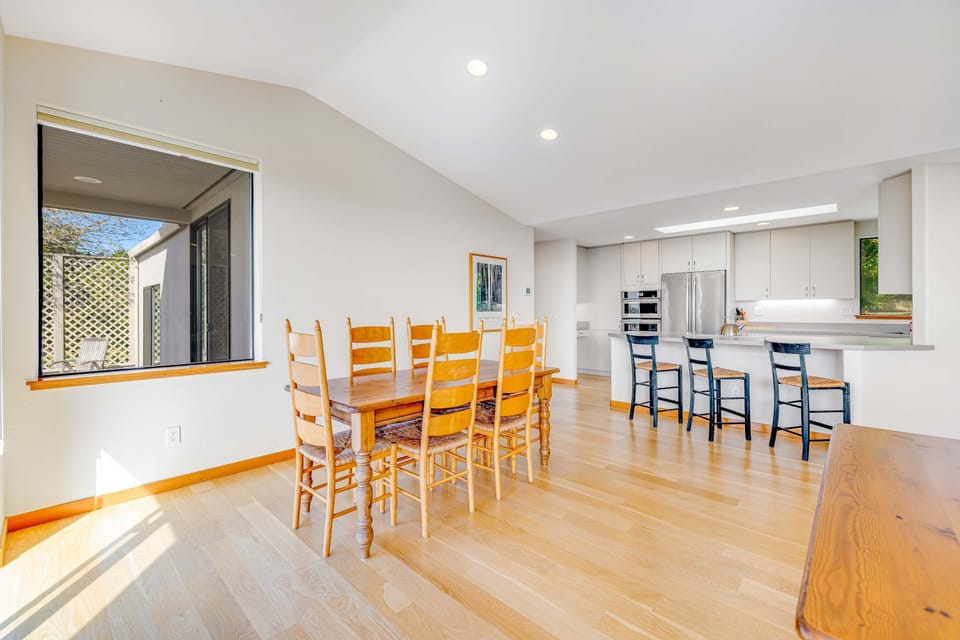 Gather around the dining table, where delicious meals and cherished memories await, all under the warm glow of natural light.