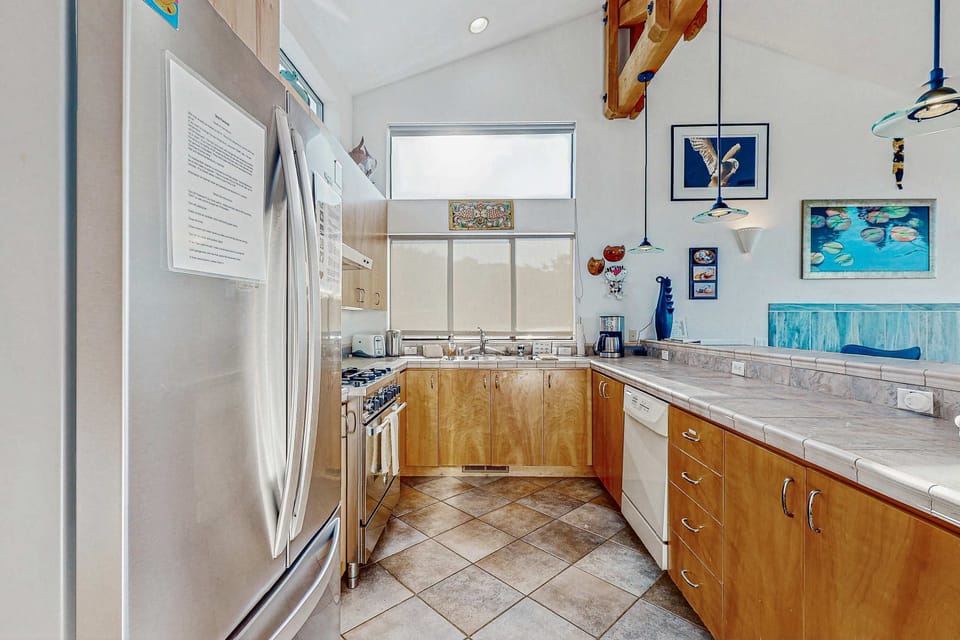 Craft your favorite meals in this airy kitchen, where natural light inspires culinary adventures.