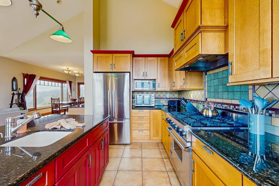 Craft gourmet meals in this well-equipped kitchen, where the coastal ambiance enhances every cooking experience.