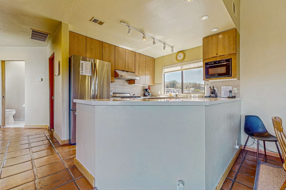 Cook up your favorite meals in this well-equipped kitchen, where culinary creativity meets stunning views of the coastline.