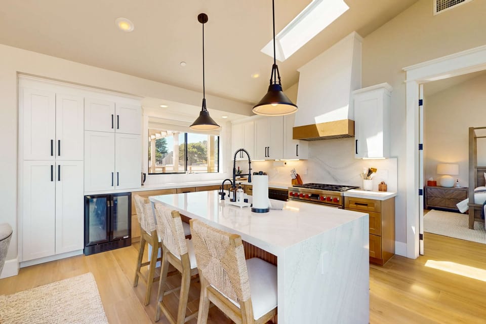 The kitchen island invites casual conversations as you prepare meals with family or friends.