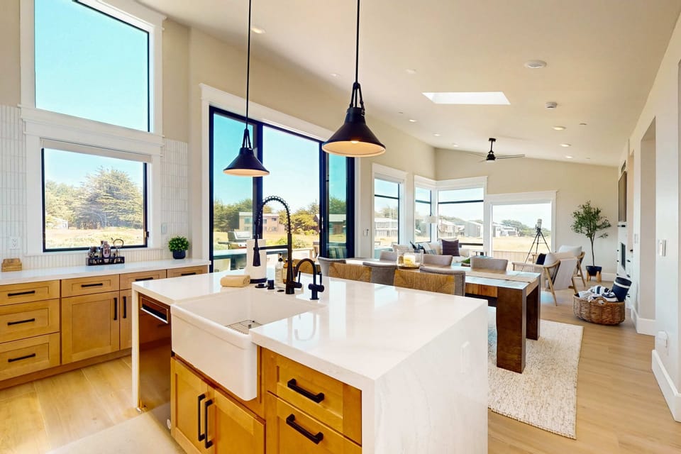 The open layout of the kitchen flows seamlessly into the dining area, perfect for enjoying meals together with ocean views.
