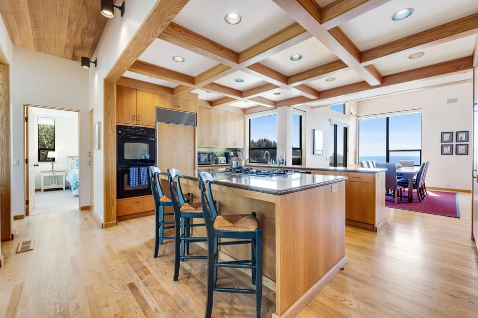 Gather around the spacious kitchen island, perfect for casual breakfasts or sharing stories over a glass of wine.