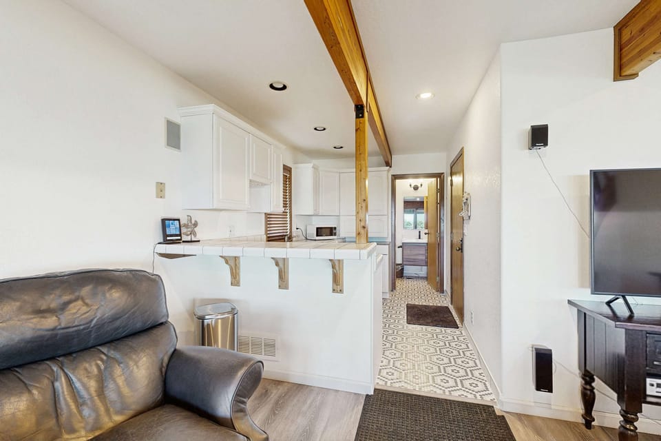 Flow seamlessly from the kitchen to the living space, ideal for entertaining family and friends while soaking in the views.