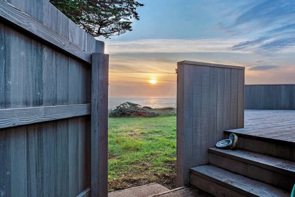 Step down to your outdoor deck, where the gentle sound of waves sets the stage for serene mornings with coffee in hand.