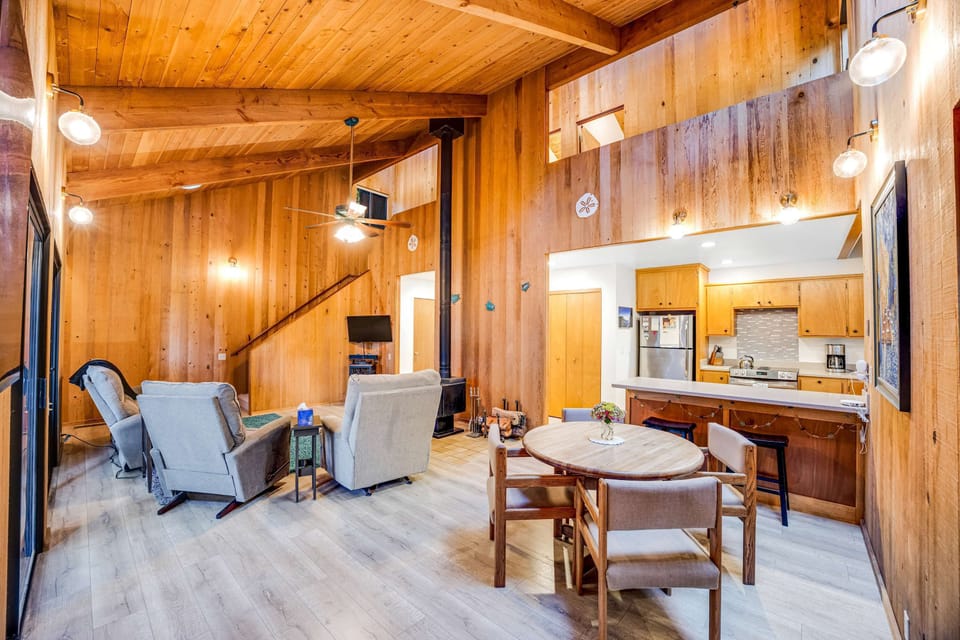 The spacious living room flows effortlessly into the kitchen, creating a warm atmosphere for family meals and game nights.