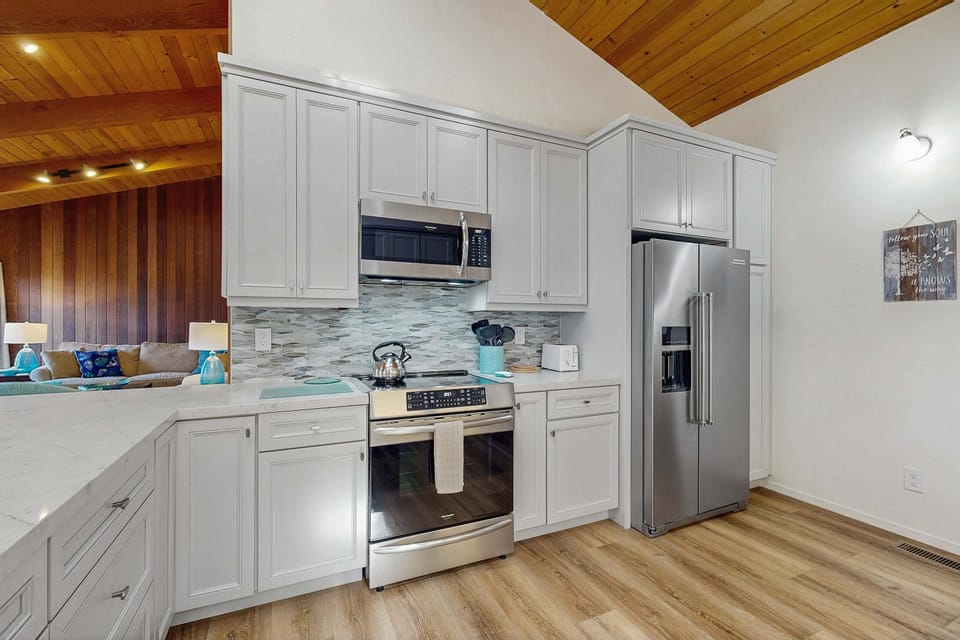 Bright and inviting, this kitchen boasts an open layout, making it easy to connect with loved ones while preparing delicious dishes.
