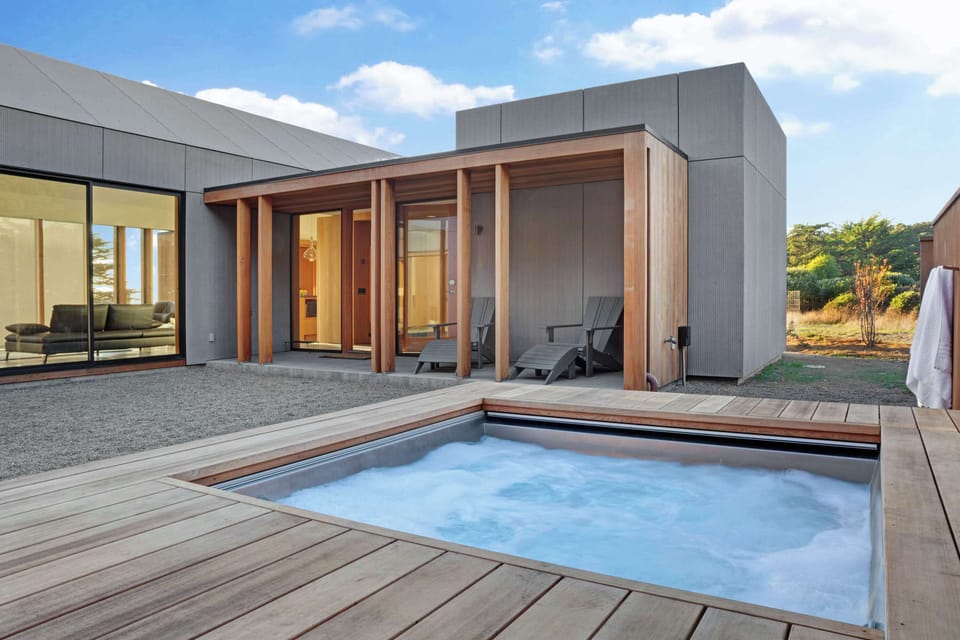 Step into relaxation in your private hot tub, where you can unwind under the stars after a day of coastal adventures.