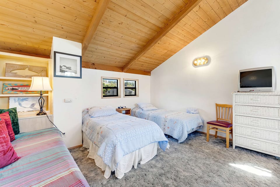 Ideal for family or friends, this cheerful bedroom offers cozy beds and playful decor, perfect for restful nights.