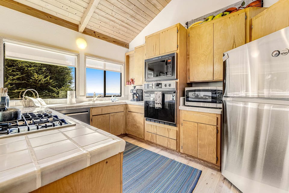 Cook up your favorite meals in this well-equipped kitchen, where culinary creativity meets ocean vistas.