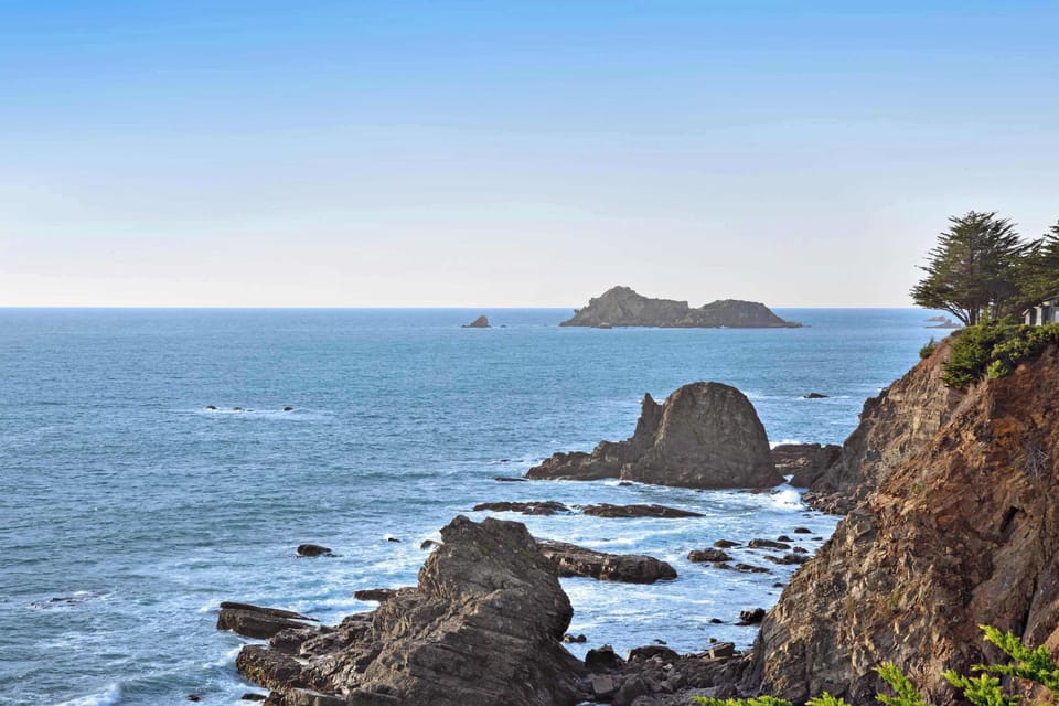 Marvel at the rugged coastline from your vantage point, where the ocean's beauty and dramatic cliffs create a picturesque backdrop.