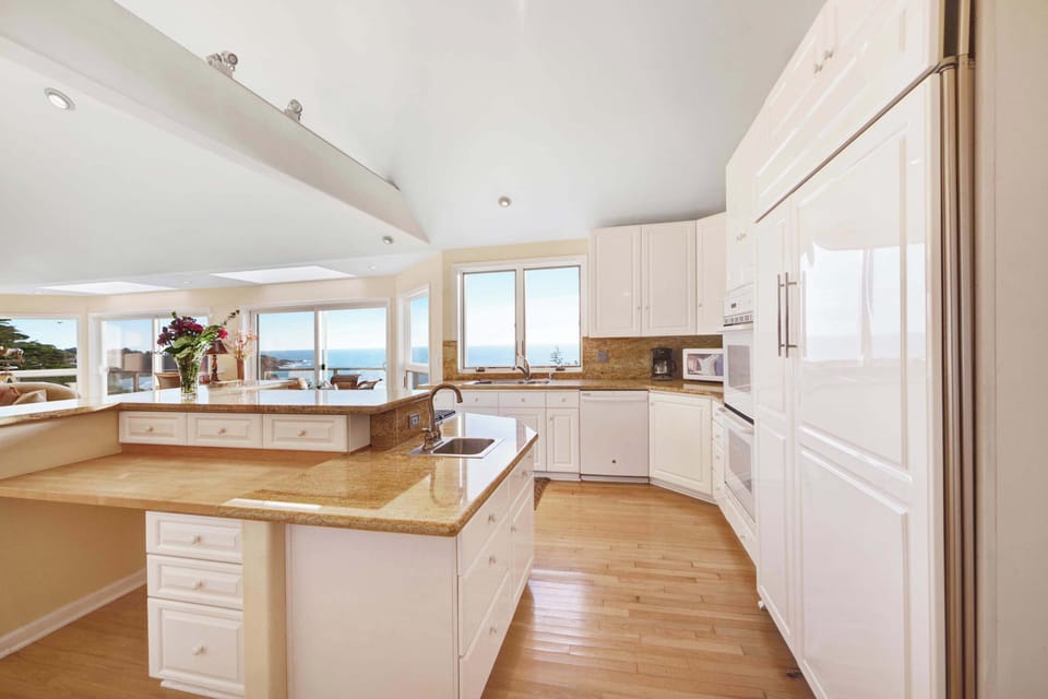 Prepare meals with a view in this beautifully designed kitchen, where culinary creativity meets stunning ocean vistas.