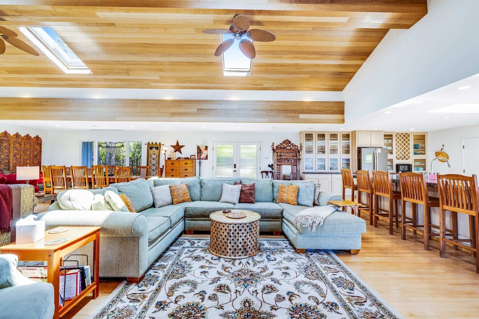 This inviting space flows seamlessly into the dining area, perfect for entertaining or enjoying family dinners.