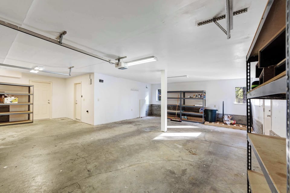 Unleash your adventurous spirit in this spacious garage, perfect for storing your gear after a day of exploring the stunning coastline.