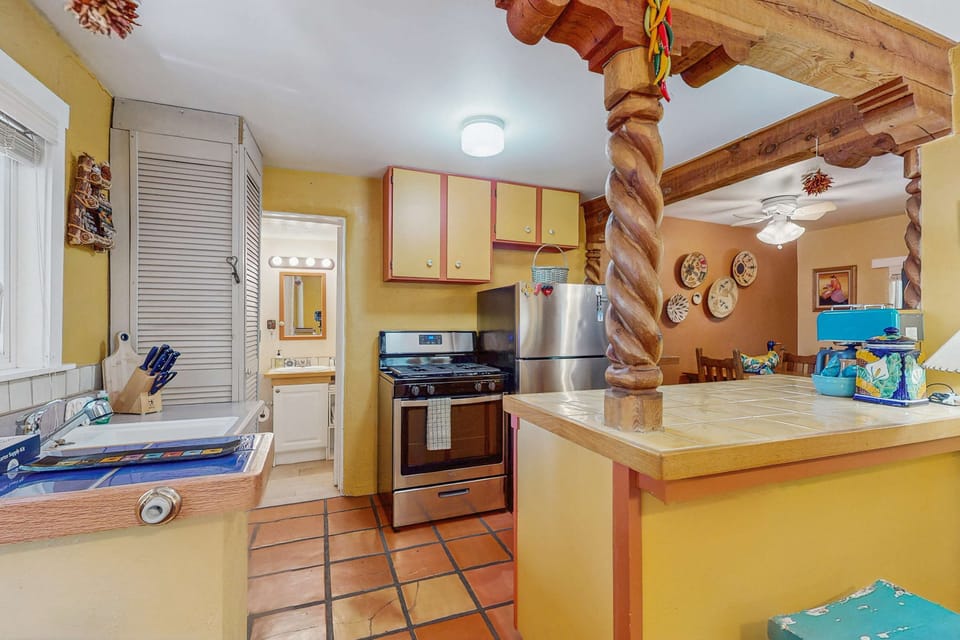 Cook in the full kitchen with a gas range and dishwasher