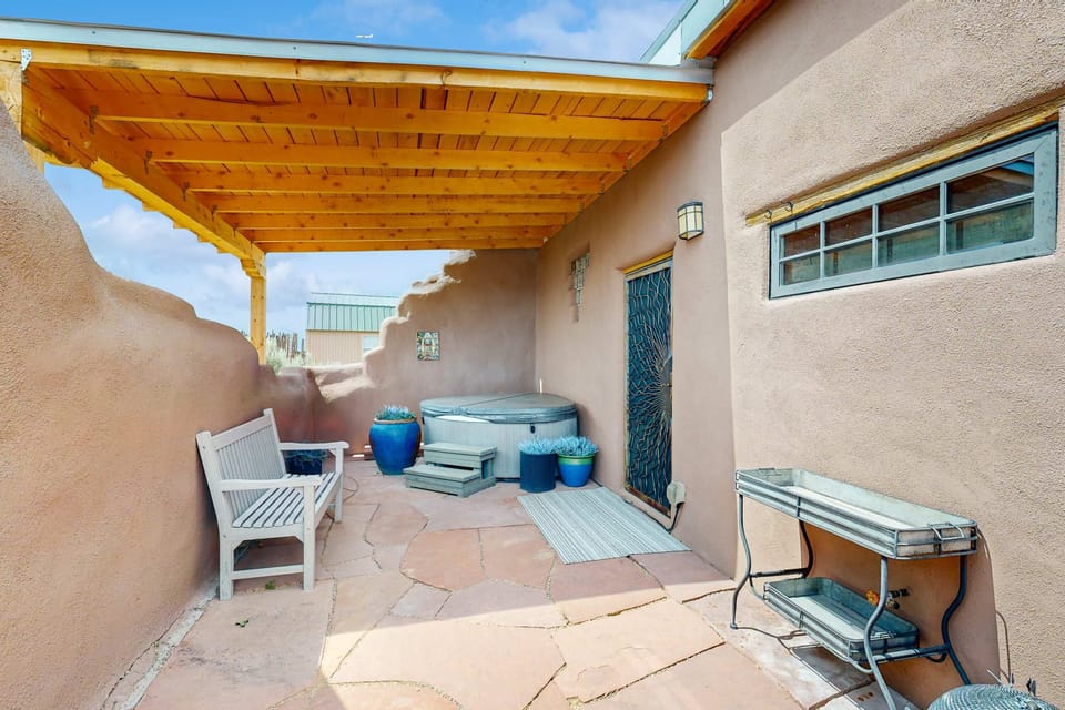 Soak in the private hot tub under the wide desert sky