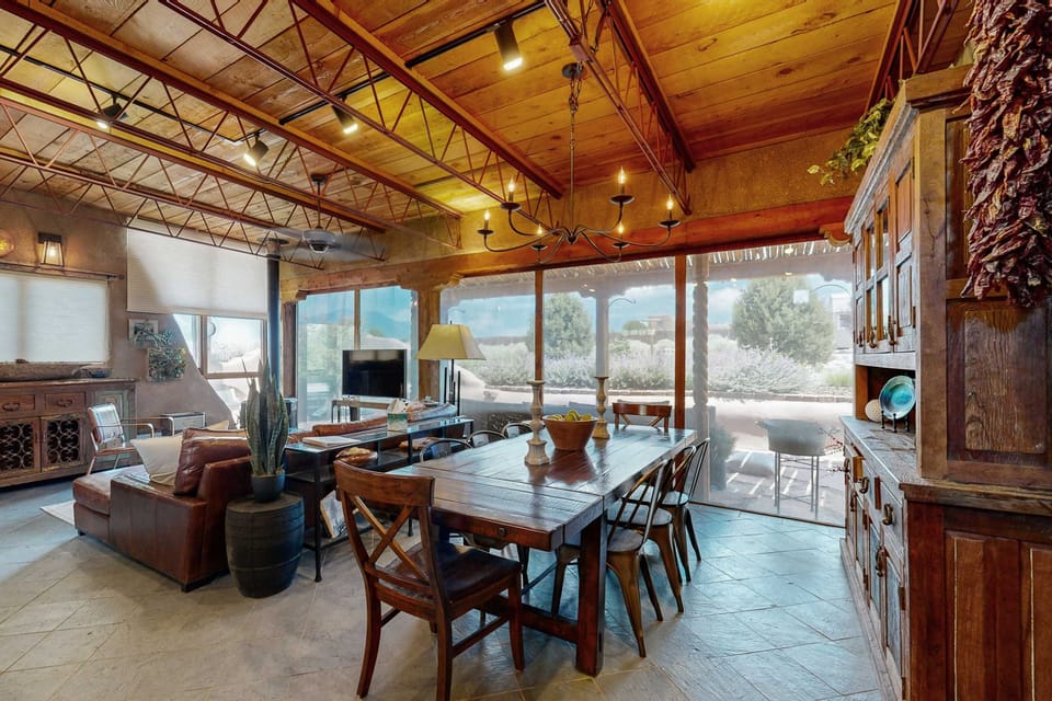 Living and dining open together with the courtyard just beyond the glass