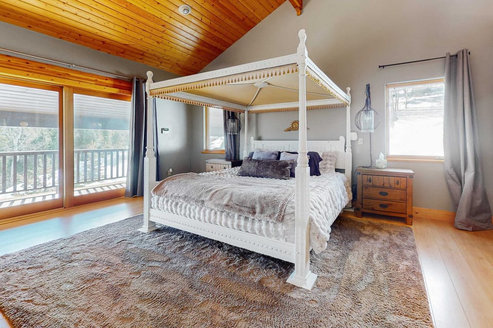 Unwind in the king primary suite with its own deck