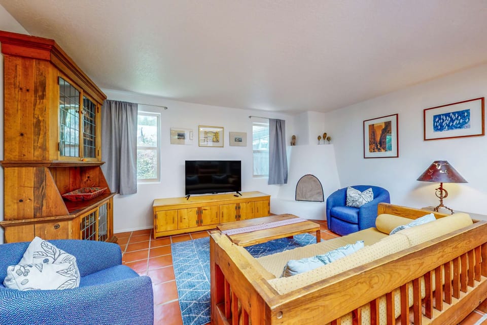 Sink into the sofa with local art on the walls and terracotta tile underfoot