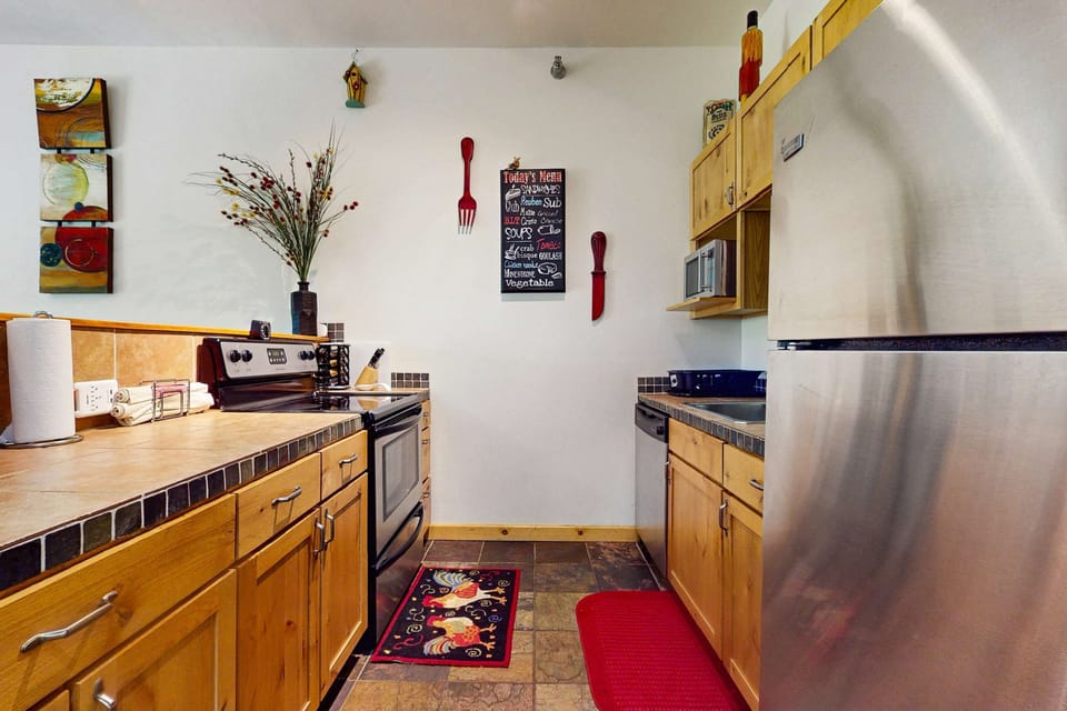 Cook with ease in the full kitchen with stove, oven, and dishwasher