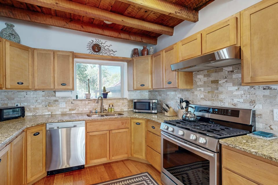 A bright kitchen with a gas range makes meal prep a breeze