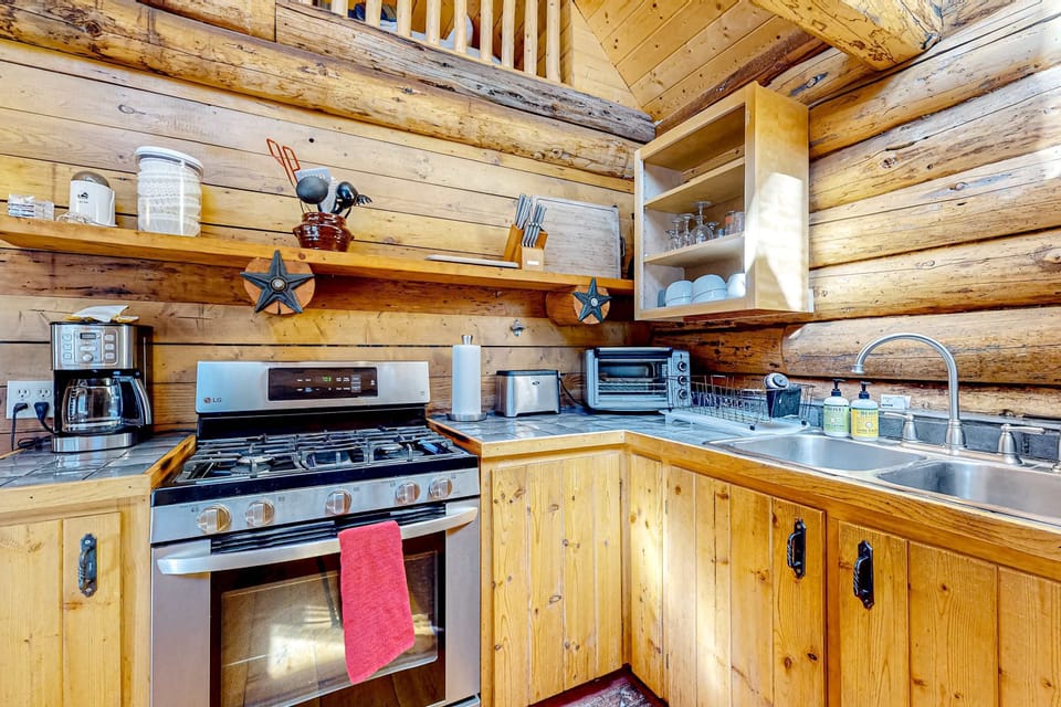 Brew morning coffee in the well-equipped cabin kitchen