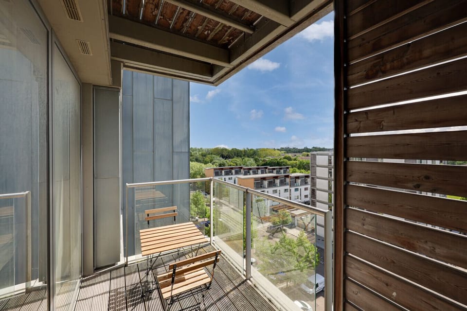 Private balcony with a table and chair set to enjoy on warm and sunny days.