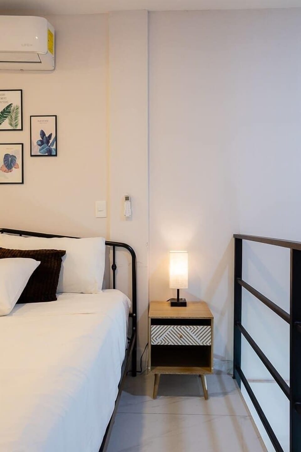 Cozy bedroom w/ bedside lighting & simple, calming design
