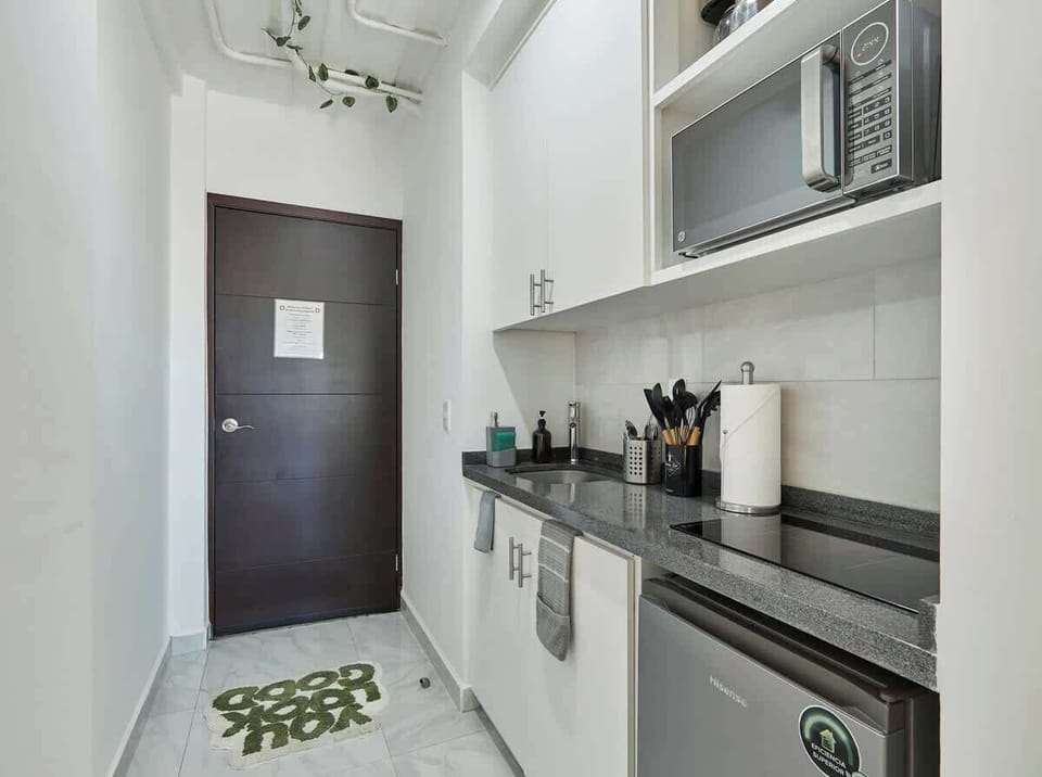 Functional kitchen w/ built-in appliances & streamlined layout