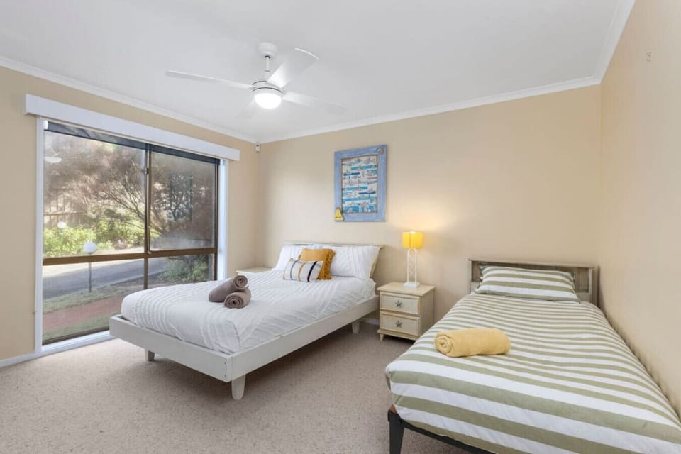 Bedroom 2: Sunny, cozy bedroom perfect for a restful family stay