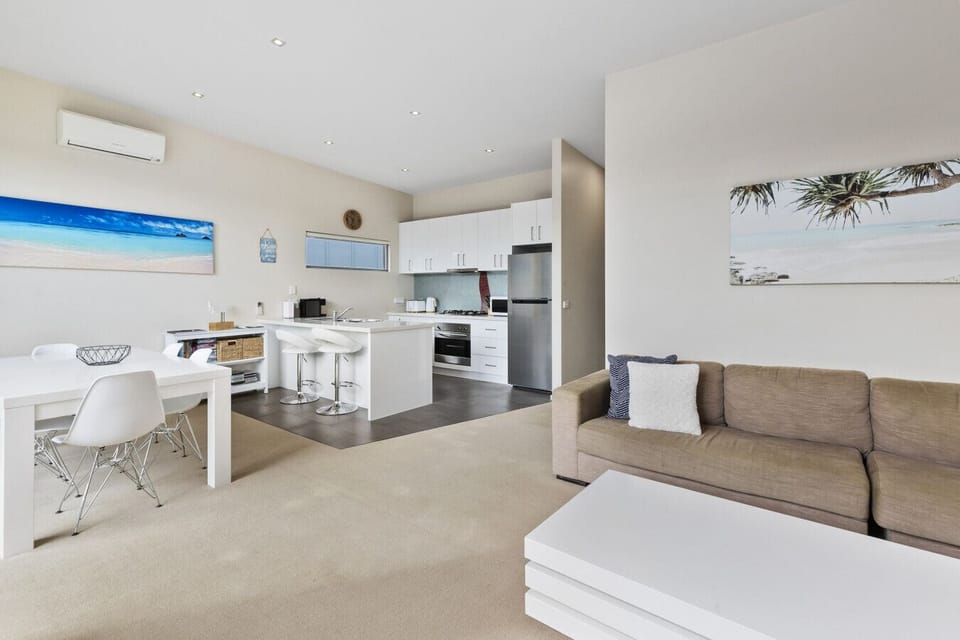 Spacious open-plan living, dining, and kitchen area designed for comfort and convenience.