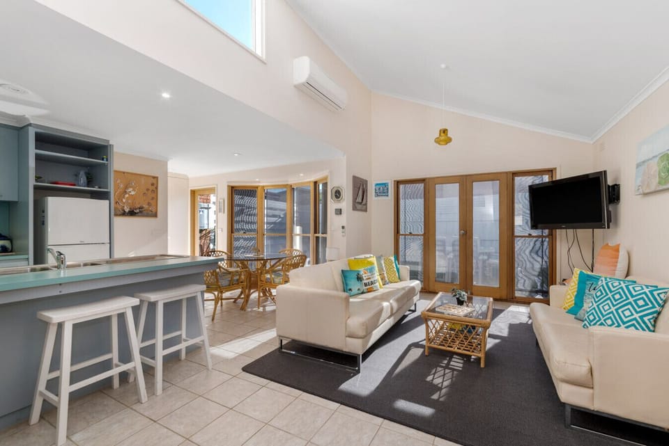 Soaring ceilings, coastal vibes, and air-con for those warm summer days.