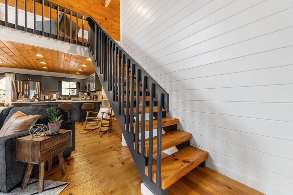 Heading upstairs, the staircase leads to even more cozy spaces.