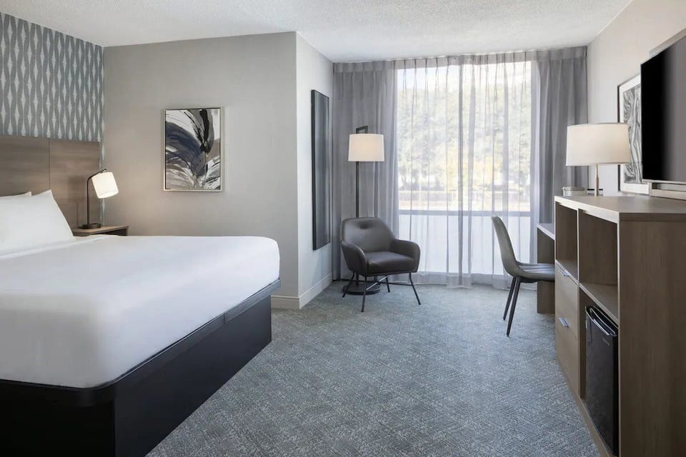 Unwind in a bright, spacious room with cozy seating.