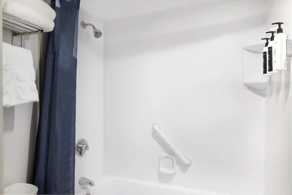 Unwind with a hot shower and plush towels within reach.