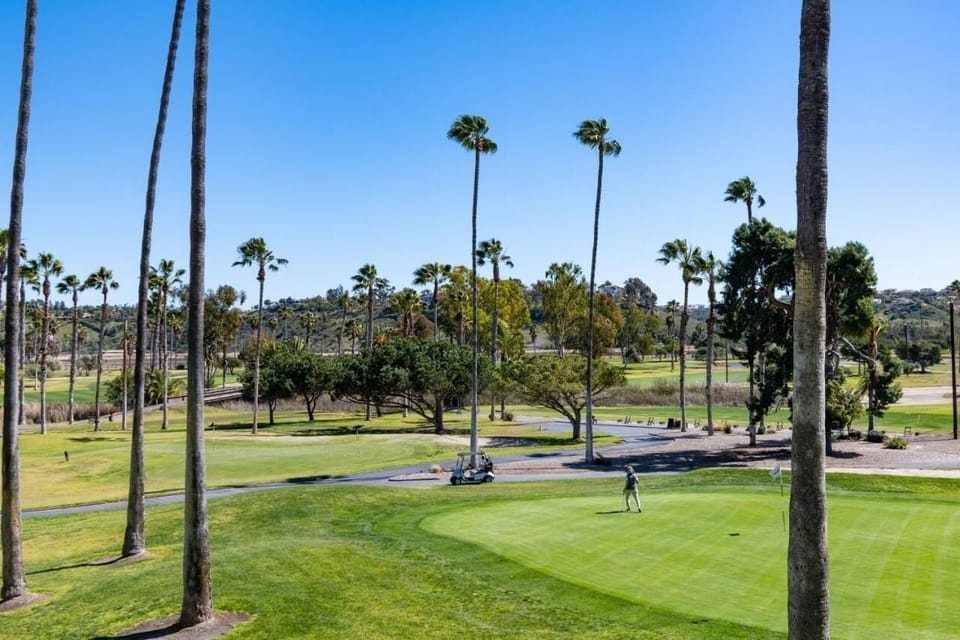 Imagine an easy afternoon stroll beside manicured greens nearby.