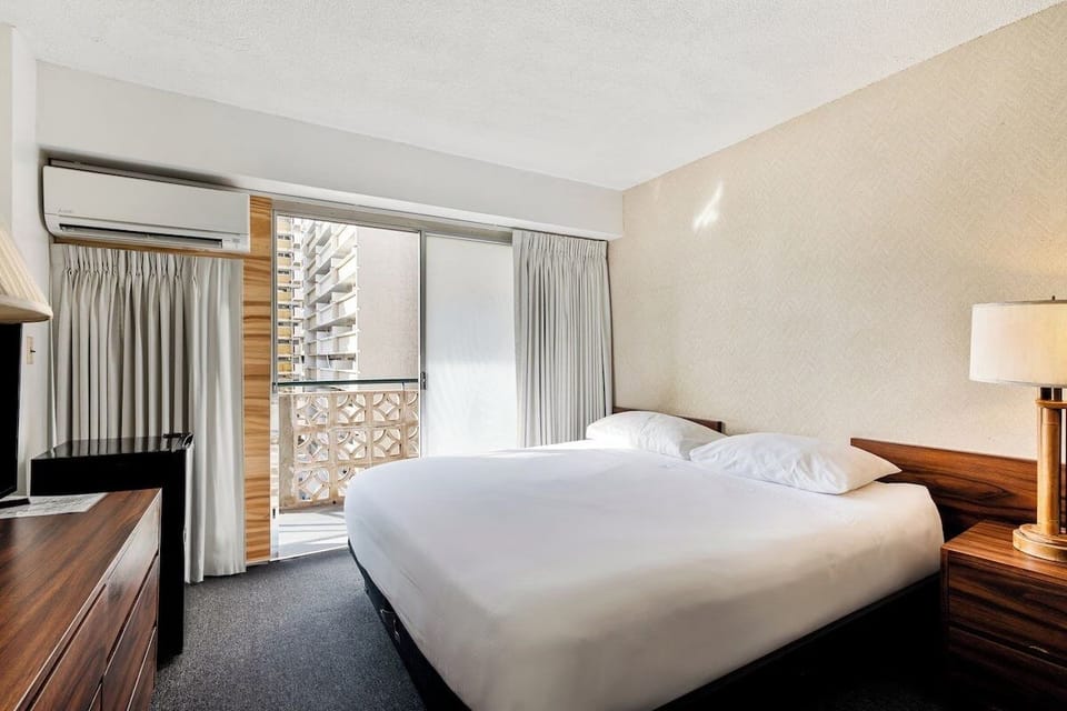 Sink into crisp linens and step out to the balcony.