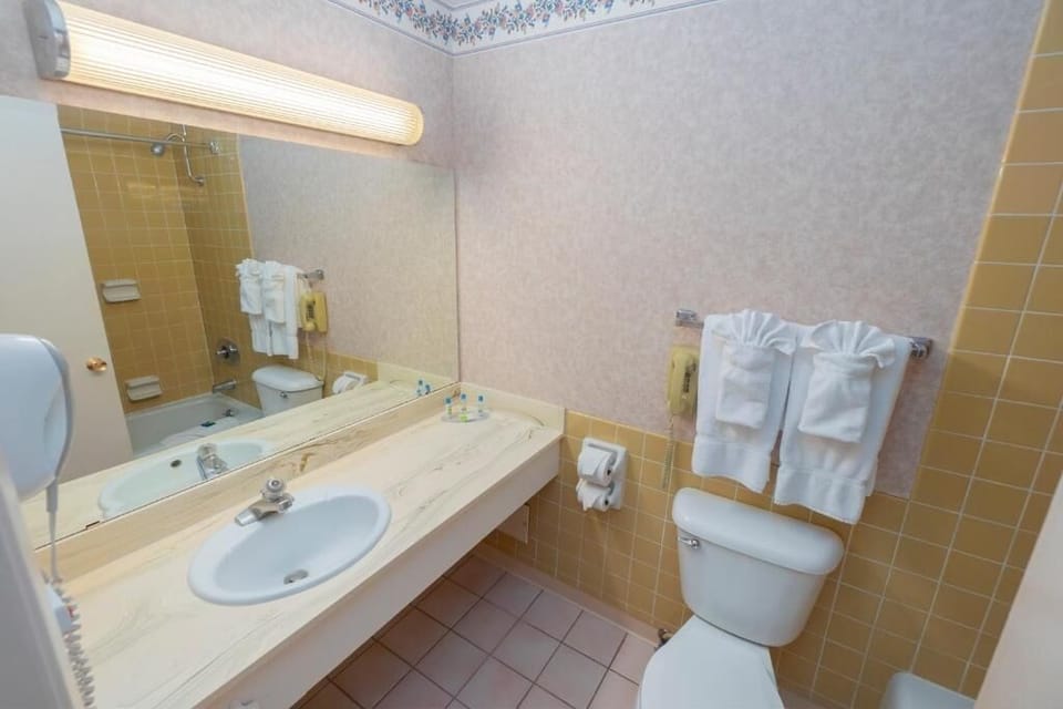 Freshen up easily with bright vanity lighting and clean surfaces.