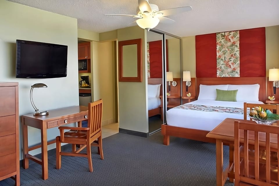 Settle in with a dedicated desk, TV, and serene sleep space