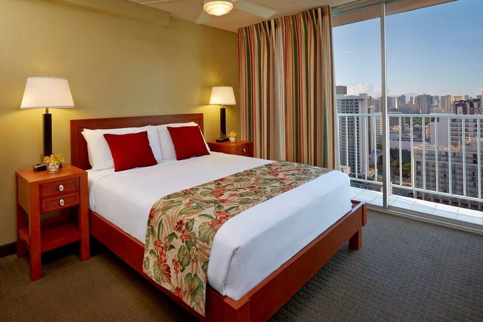 Drift off after sunset with balcony views and crisp linens