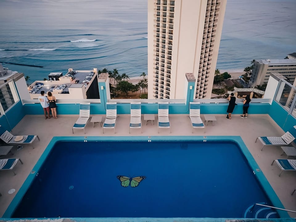 Unwind at dusk as waves roll beneath the rooftop deck.