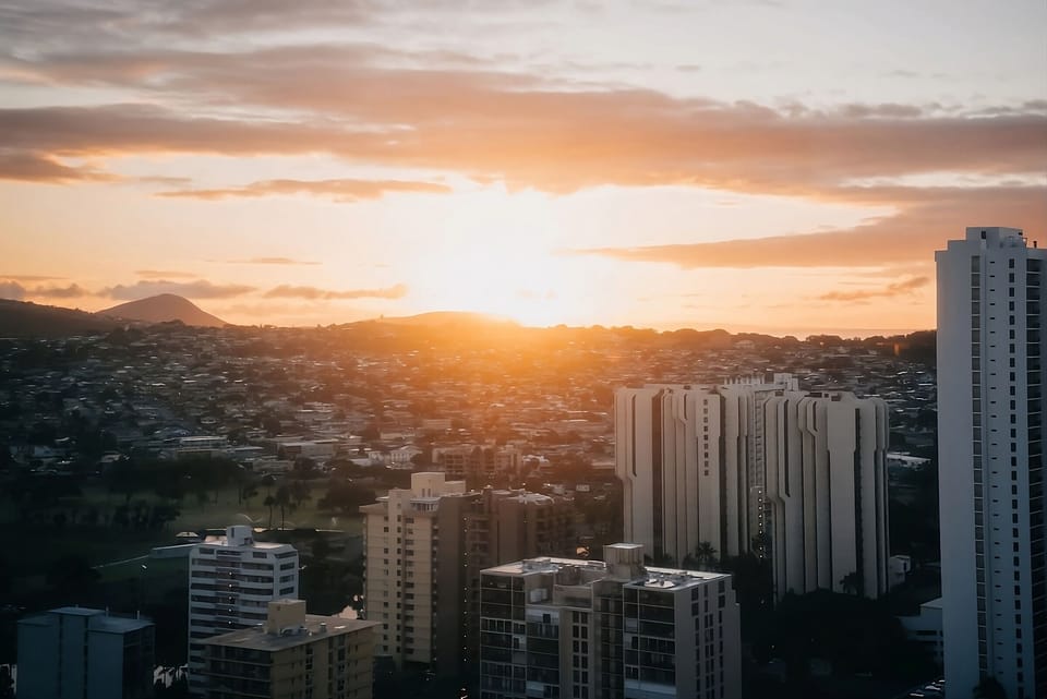 Soak in golden-hour horizons above the city lights.