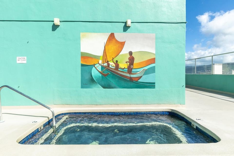 Savor playful island vibes beside the water’s colorful mural.