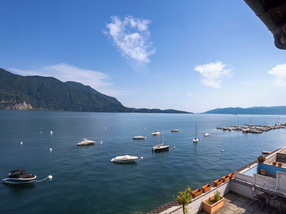 Water, Mountainous Landforms, Body Of Water, Boat, Mountain, Watercraft, Hill, Coastal And Oceanic Landforms, Waterway, Sea