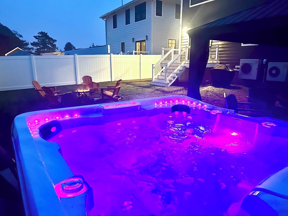 Unwind in the private hot tub under the stars at Slack Tide Retreat