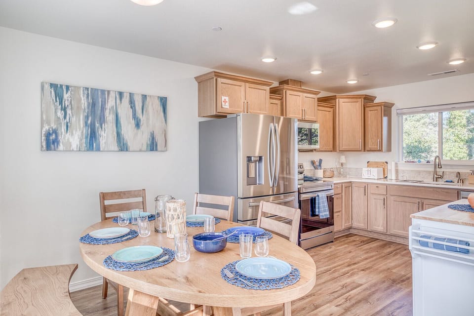 Your modern kitchen awaits with warm wood finishes and bright, open design perfect for cooking memorable meals during your stay.