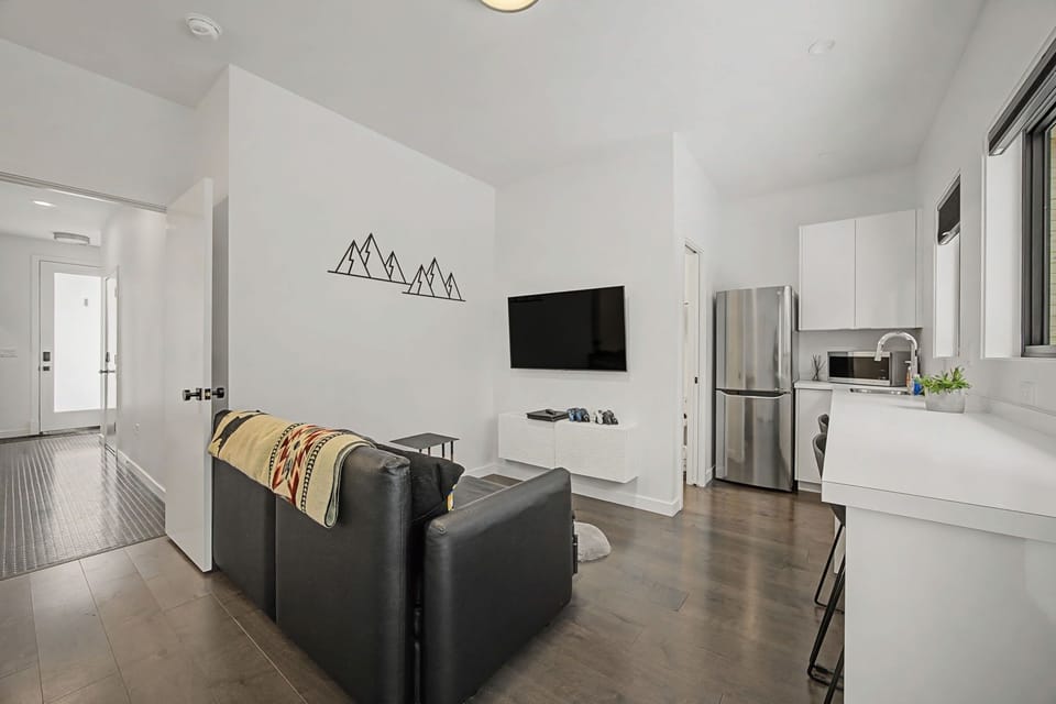 Unwind in your sleek, open-concept space with modern comforts and mountain-inspired touches perfectly designed for your getaway.